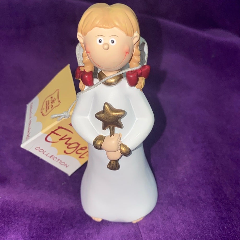 Gilde Angel and Ornaments. Item no: 28047. Girl standing holding star.